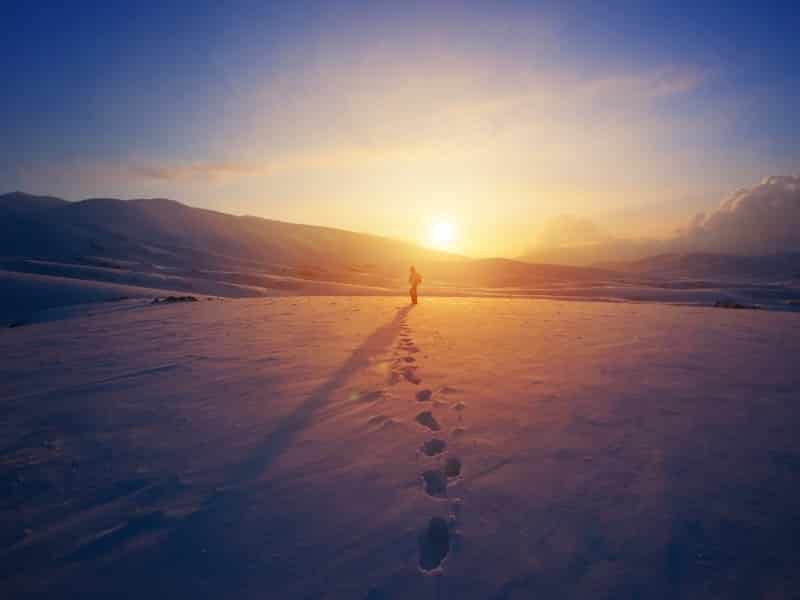 footprints on beach sunset