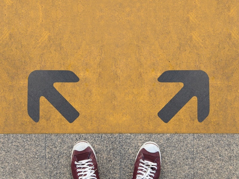 feet pointing to two arrows